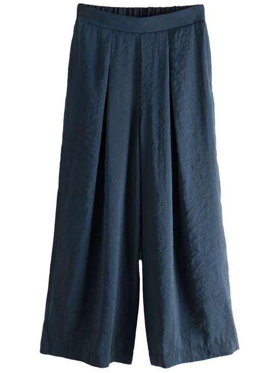 Брюки свободного кроя со складками